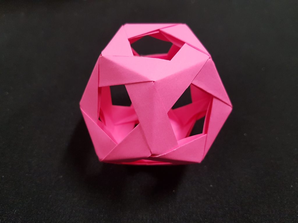 Pink dodecahedron made from post-it notes
