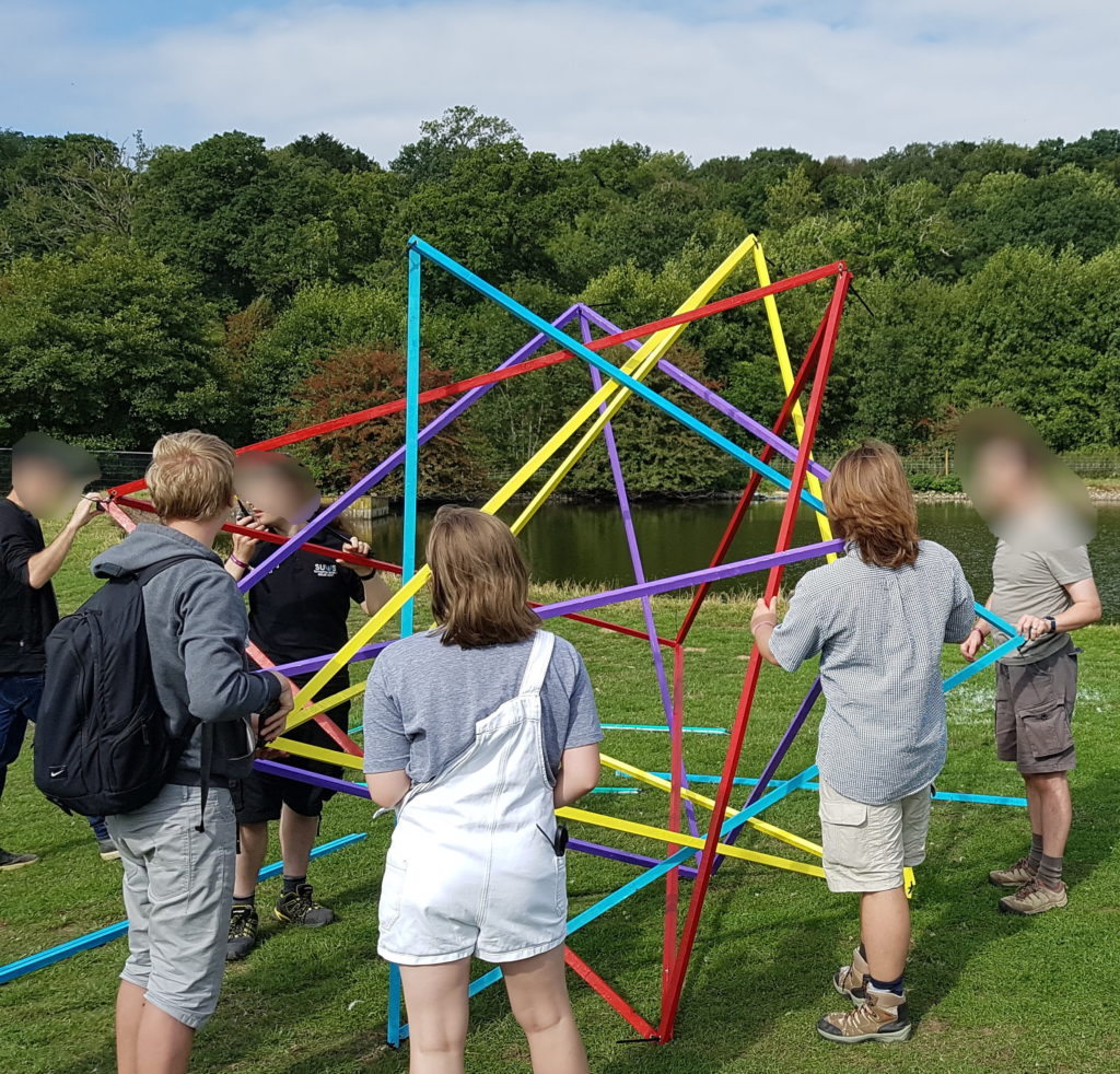 Five intersecting tetrahedra model in a field